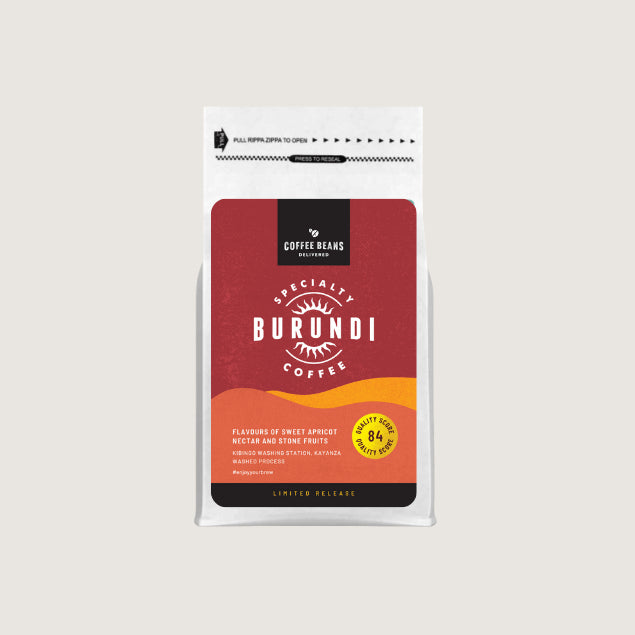 burundi coffee beans single origin label for coffee bag with deep reds orange and pastel salmon colours and coffee descriptions