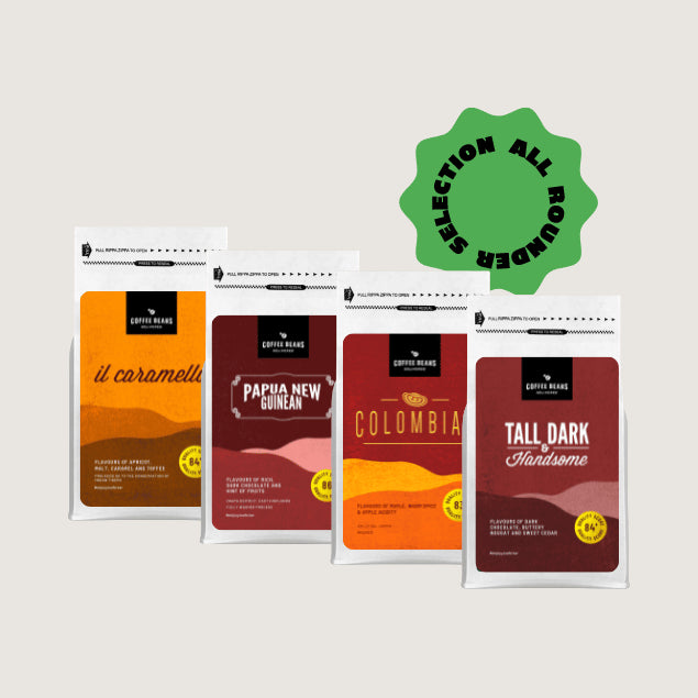 four bags of coffee beans showing a selection of coffee blends and single origins called the all rounder sampler pack