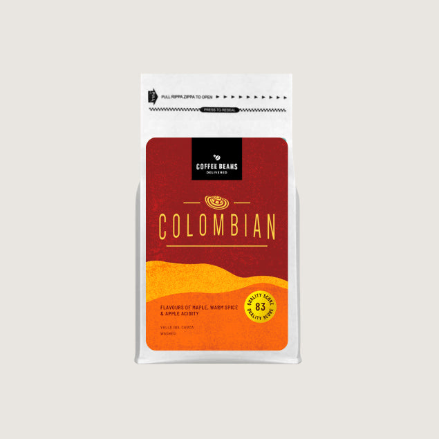 colombian coffee single origin label for a coffee bag with colours of deep red and oranges with coffee descriptions and flavours