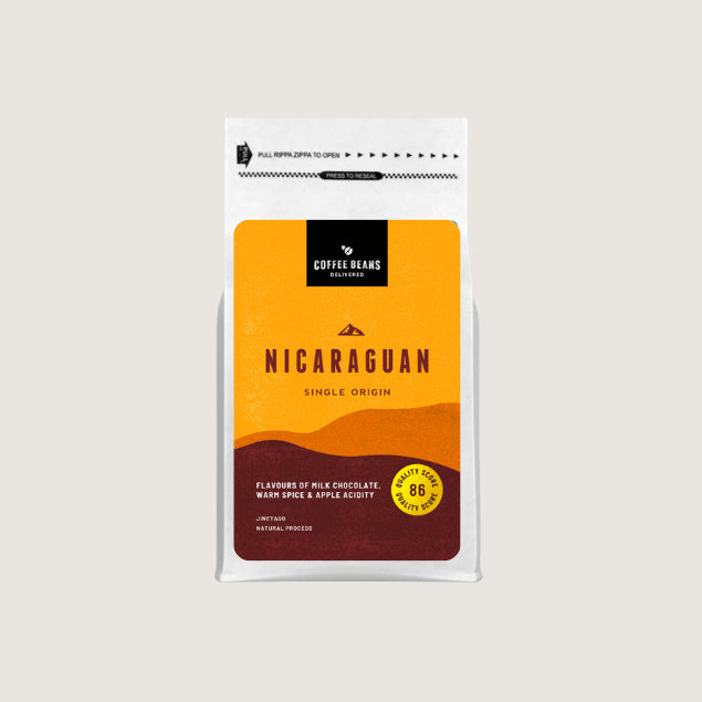 A modern Nicaraguan single origin coffee beans logo designed for a label on a coffee bag with golden colours and deep reds wavy shapes and descriptions of the flavours