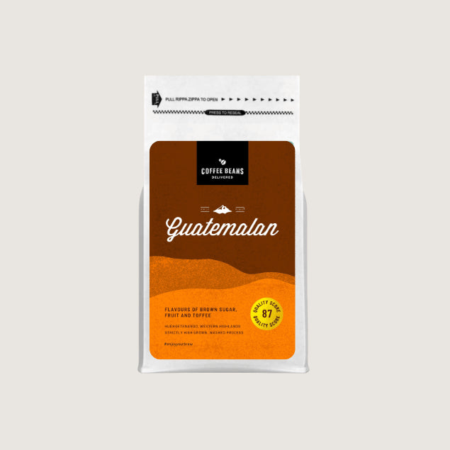 A coffee bag with modern design Guatemalan coffee logo on a label with colours of light browns and information