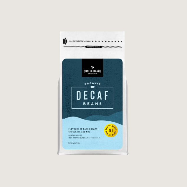 A modern decaf coffee beans logo on a blue label with shapes and coffee farm information