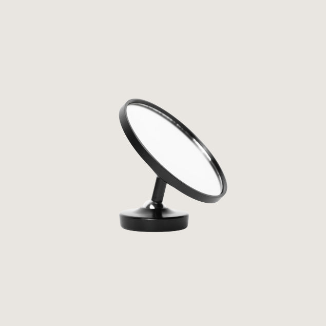 Pesado Shot Mirror, positioned upright, showcasing the reflective surface.